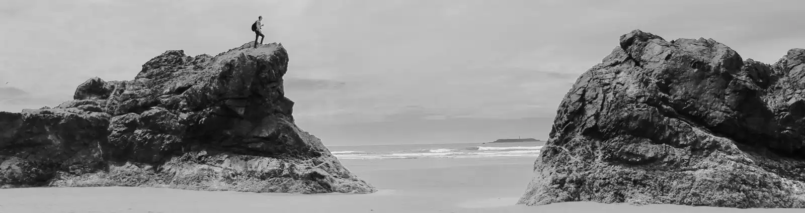 An image of me on some rocks at the beach